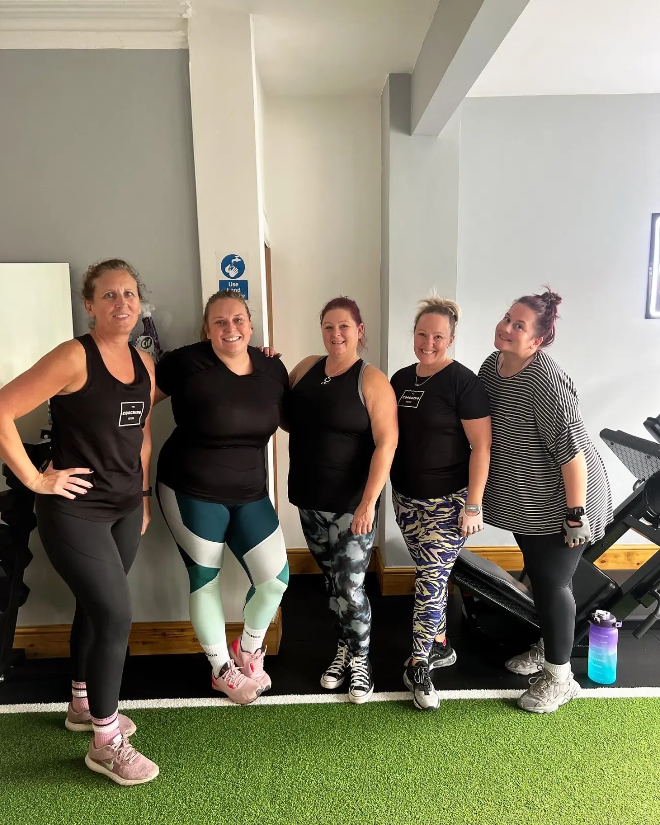 The Coaching Room team together in the gym